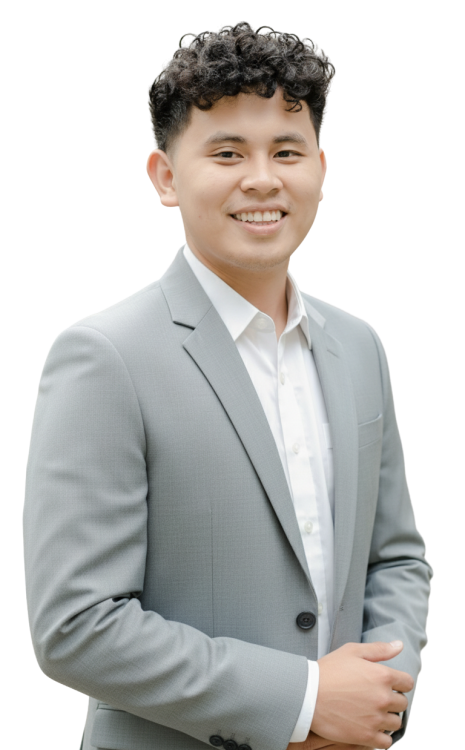 Professional young man in a light gray suit smiling confidently